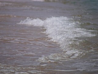 Ocean waves breaking at the beach