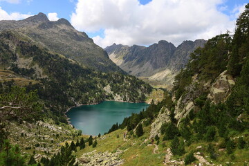 View of Era Restanca glacial lake before the last descent stretch to Restanca refuge on GR11 long-distance hiking trail, Aiguestortes & Estany de Sant Maurici National Park