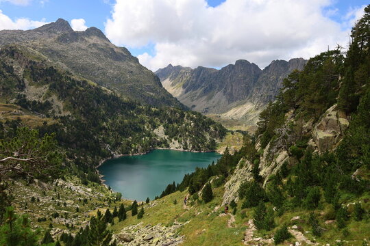 View of Era Restanca glacial lake before the last descent stretch to Restanca refuge on GR11 long-distance hiking trail, Aiguestortes & Estany de Sant Maurici National Park