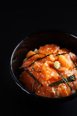 Salmon Sashimi Bowl Donburi japanese food isolate in black background