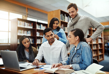 Studying, students and laptop in university library for research project, education and assignment teamwork. Diversity study group, books and people with brainstorming at college for test preparation