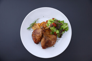 Duck leg confit with sauce. isolate in white background. top view. Duck confit on white plate