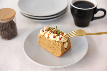 Tasty Caramel Nut Cake in white dish isolated on white background