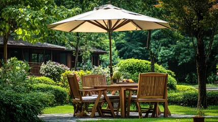 Obraz premium a wooden table and chairs with an umbrella in a green park garden