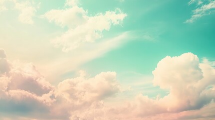 Obraz premium Stunning Pastel Blue Sky with Fluffy Clouds, Vintage Retro-Style Wallpaper for Design Inspiration. Soft and Dreamy Aesthetics for Creative Projects.