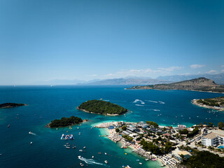 Aerial drone view of Ksamil, its beaches, islands and beautiful turqoise sea, Sarande, Adriatic Sea, Albania.