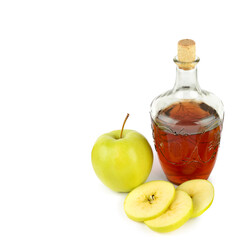 Apple vinegar in a bottle and fresh apples isolated on a white. There is free space for text.