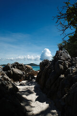 Beach rock in sunny day with blue sky.