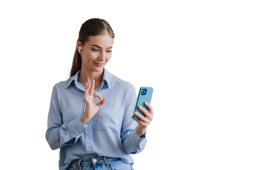 young woman making an "OK" gesture during a video call, holding a smartphone and wearing wireless earbuds against transparent background. Concept of digital communication and positive interaction
