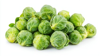 Fototapeta premium A pile of fresh green Brussels sprouts on a white background.