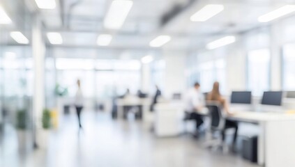 Blurred office interior with people working in the blurred background