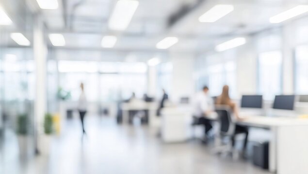 Blurred office interior with people working in the blurred background