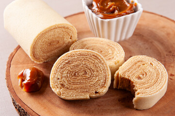 Typical dessert from northeastern Brazil called Bolo de Rolo. Stuffed with dulce de leche or guava paste. Selective focus