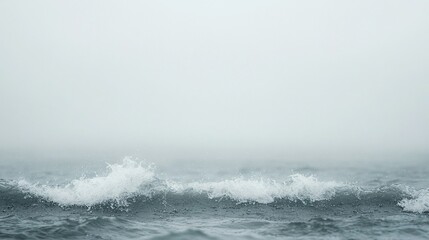 Fototapeta premium A person balancing on a surfboard amidst a body of water with a hazy sky in the backdrop