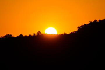 Golden sunrise over the mountain. Beautiful sunset
