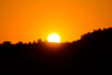 Golden sunrise over the mountain. Beautiful sunset
