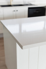 Empty Stone Kitchen Countertop In Modern Kitchen - stock photo - light/white quartz top