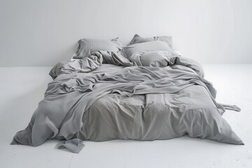 Gray bed with white linens on a cozy background