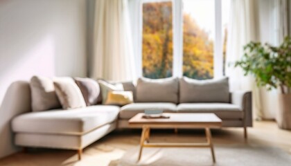 Blurred view of light living room with sofa and soft bench; unfocused background photo; selective focus
