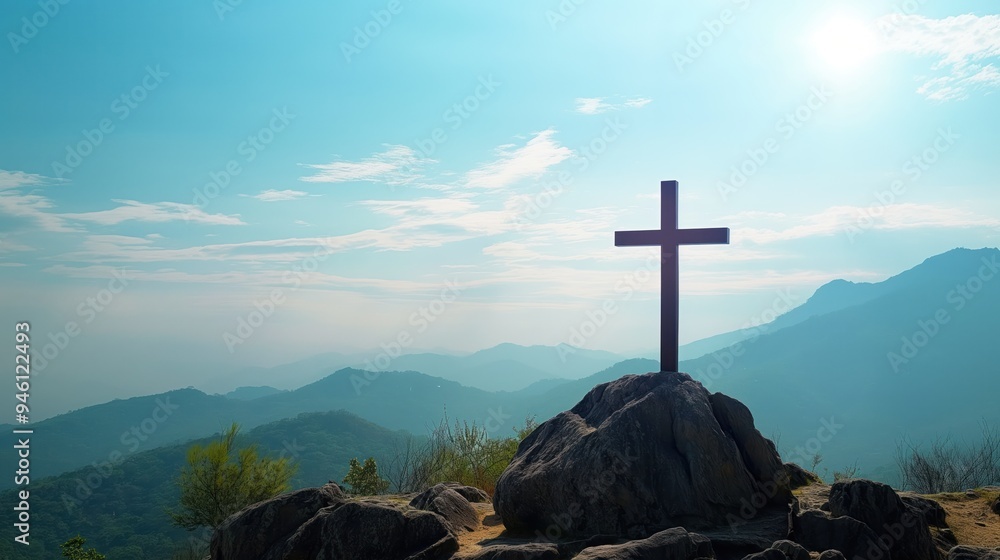 Wall mural risen jesus christ stands atop a rugged rock formation as the sun rises in the background, symbolizi