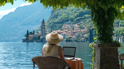 A happy digital nomad freelancer who work remotely from a laptop on the shores of Lake Como, Italy, in a flexible and active work environment with beautiful scenery. Replication space