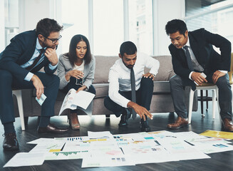 Business, people and planning on floor with paperwork for brainstorming, creative project or color...