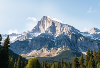 Obraz premium Majestic Snow-Capped Mountain Peak with Foreground Forest