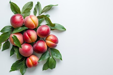 A cluster of ripe peaches with green leaves on a light background.