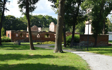 park in the parkruins of an castle. the ruins of a building that was built of red brick
