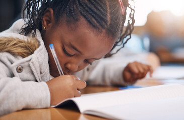 Black girl, class and writing in book for education, studying notes and information in workbook....