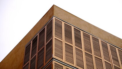 contemporary building facade corner of wooden shutters
