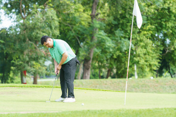 Man is playing golf in morning.