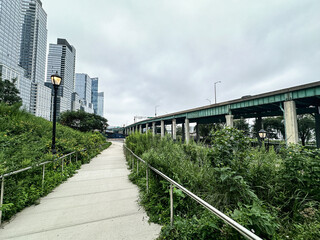 Pathway in a New York City Park on the Upper West Side Manhattan on an overcast day. View of the...