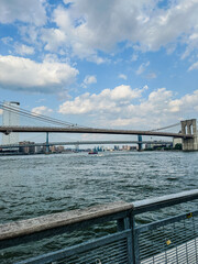 View of the Brooklyn Bridge and Manhattan Bridge side by side over the East River. New York City Manhattan Seaport angle 