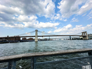 View of the Brooklyn Bridge and Manhattan Bridge side by side over the East River. New York City Manhattan Seaport angle 