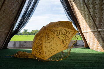 A beautiful yellow umbrella made by hand embroidery. A traditional yellow umbrella from Asia...