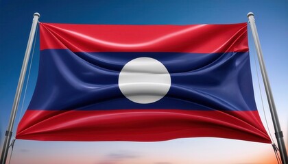 The national flag of Laos, a red, blue, and white flag with a white circle in the center, waves in the wind against a blue sky.