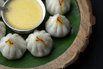 Steamed or ukdiche Modak. It's a traditional sweet dish made out of coconut, jaggery and dry fruits stuffed inside rice dough. Offered to Lord Ganesha