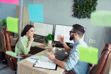 Photo of positive good mood employers dressed shirts having interview indoors workshop workstation