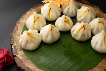 Steamed Modak, white modak, ukdiche modak made from rice flour and coconut jaggery filling. Modak is a traditional Indian sweet made during Ganesh Utsav