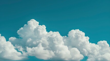Naklejka premium Fluffy White Clouds Against a Teal Sky