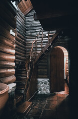 CORDOBA, ARGENTINA, MAY 4, 2022: Mysterious view of wooden cabin with a door letting light passing through