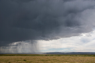 Thunderstorm storm on the prairie rain tractor farm field agriculture