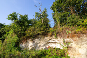 Ruins of old cave dwelling in the hillside of Marigny-Brizay village