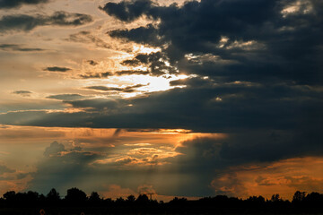 Sunset over the fields near Königsbrunn in a cloudy sky