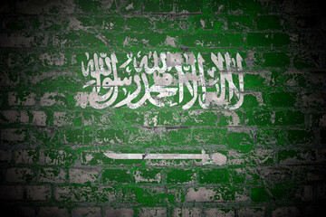 Flag of Saudi Arabia on brick wall