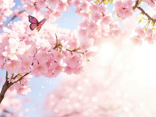 Fleecedeken met foto Butterfly fluttering and a branch of pink cherry or sakura blossoms in the sunlight. springtime floral theme for the backdrop, © REZAUL4513