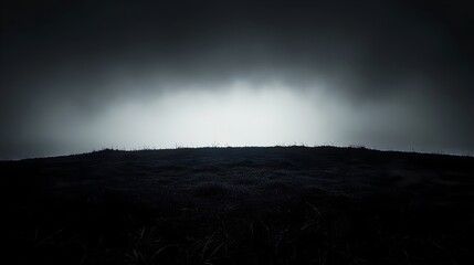 A conceptual image depicting the darkness creeping over a tranquil landscape with the light gradually fading away leaving only silhouetted forms and ample copy space for text or design elements