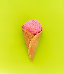 a ball of pink yarn in a waffle cone for ice cream