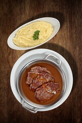 Filet mignon with Marsala sauce and mashed potatoes, seen from above